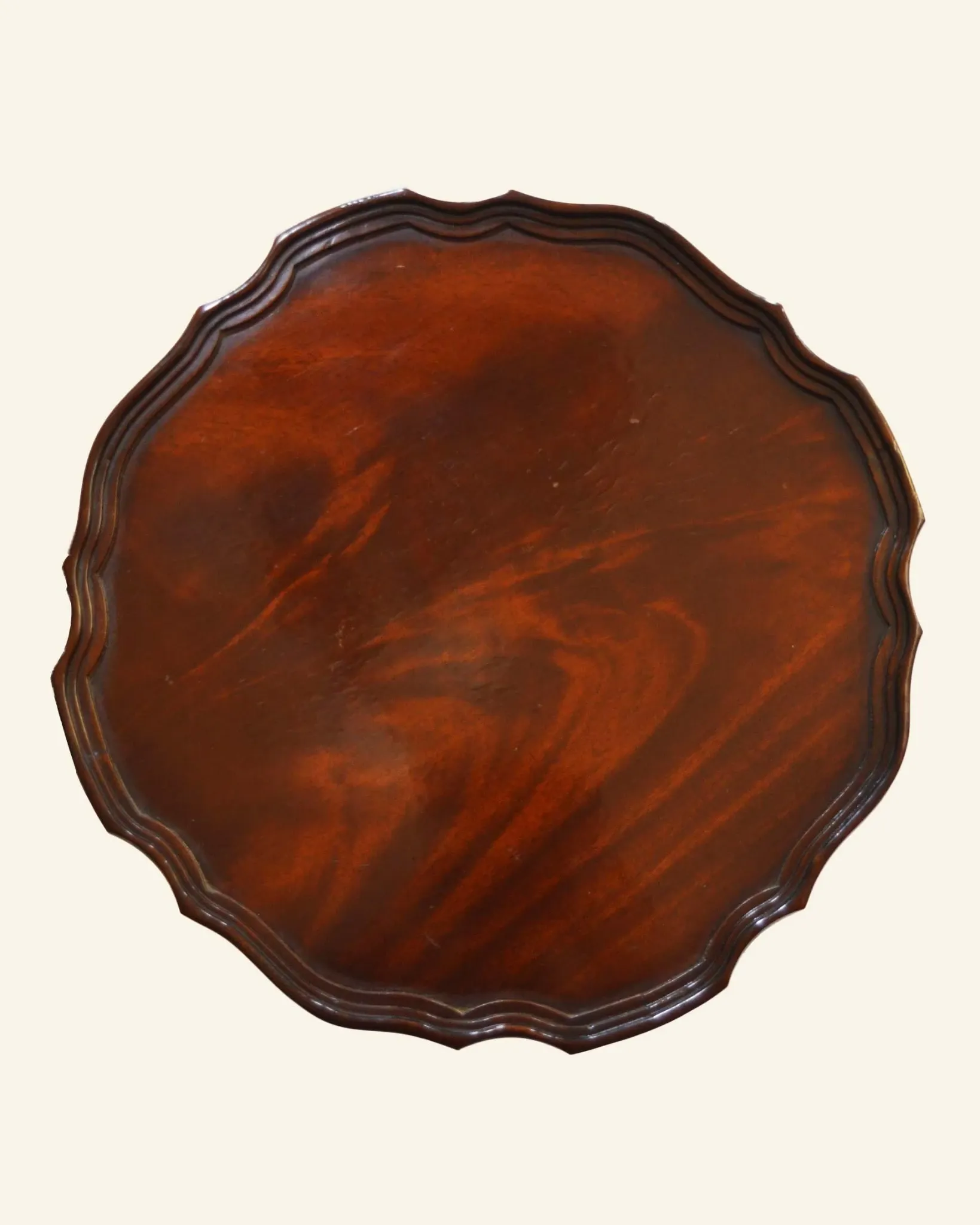 African mahogany guéridon, turned with a sculpted tripod leg.