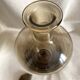 Art Deco smoked glass carafe with fan-shaped stopper.