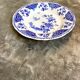 Round and hollow gien dish in white and blue enamelled earthenware