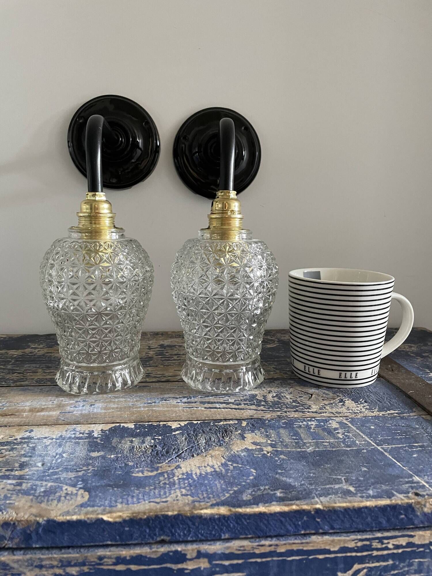 Pair of vintage electrified to nine-piece chiseled glass wall lamps