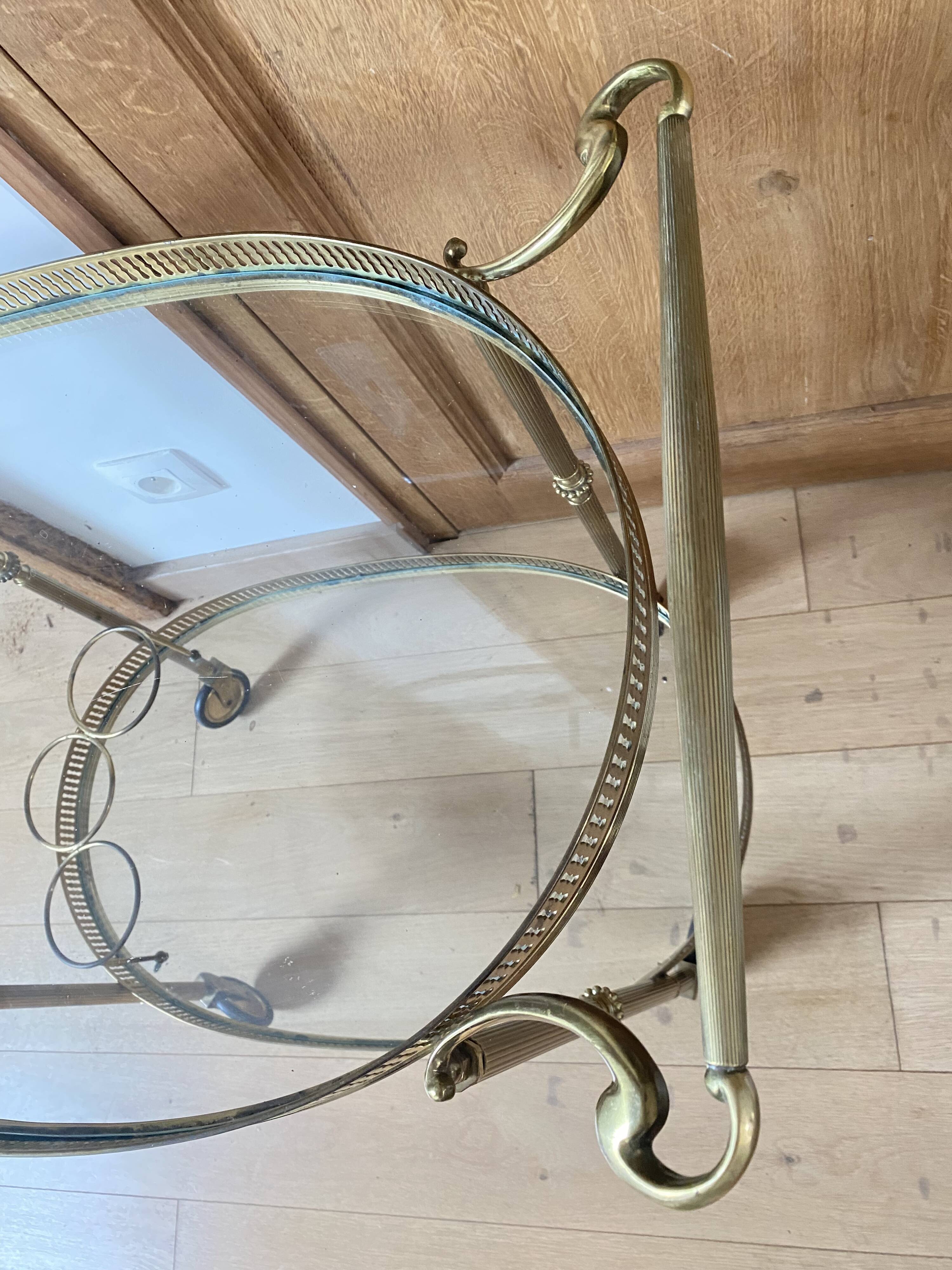 Oval golden brass rolling dessert trolley, Maison Jansen style, 1960s.