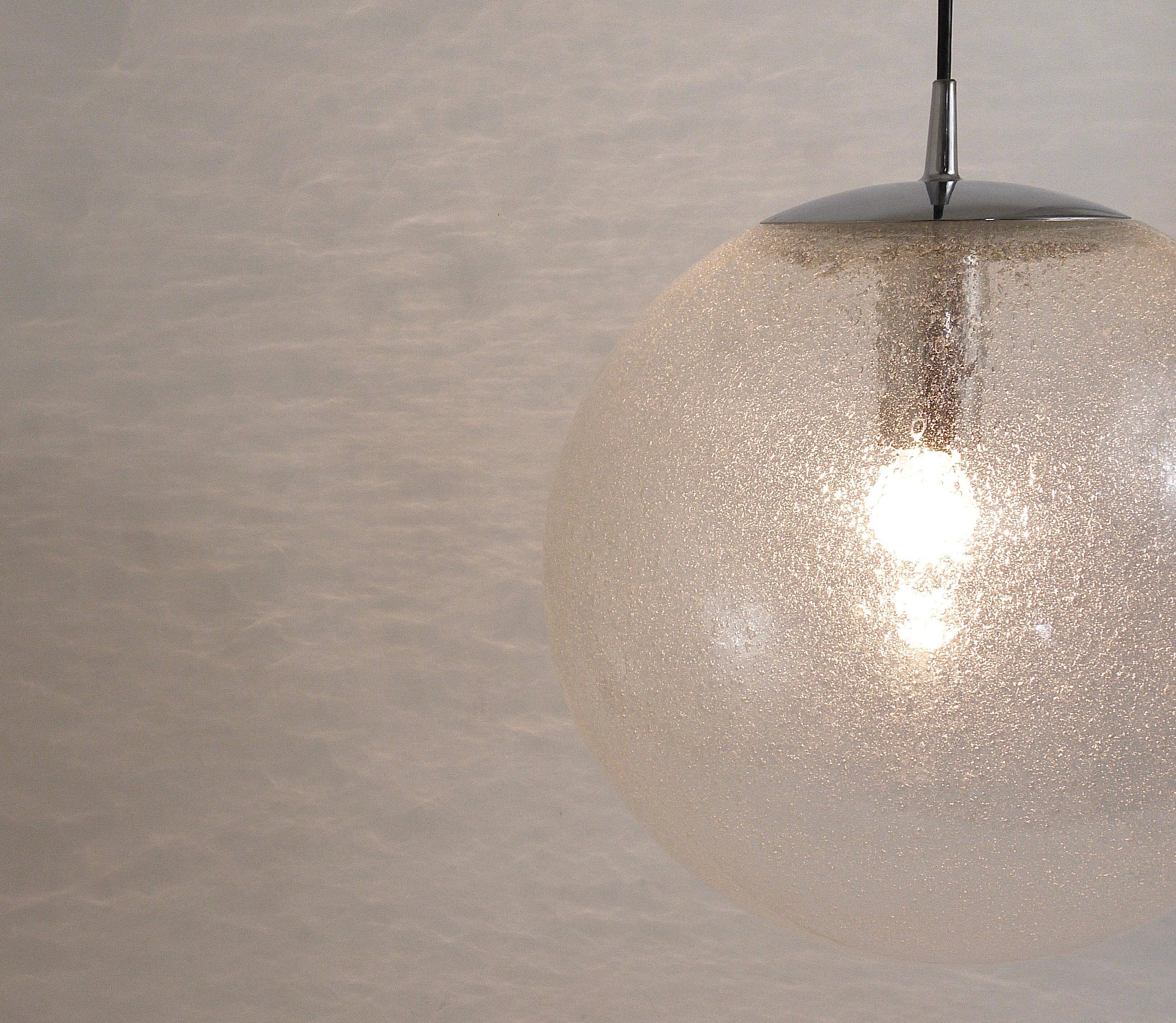 Large glass globe pendant light with bubbles and chrome by Peil & Putzler, Germany, 1970s.