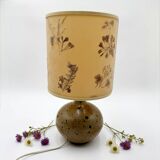Pyrite stone ball lamp with a lampshade featuring dried flower inclusions.