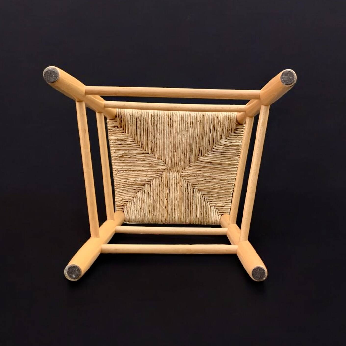 Old wooden and straw high chair for children