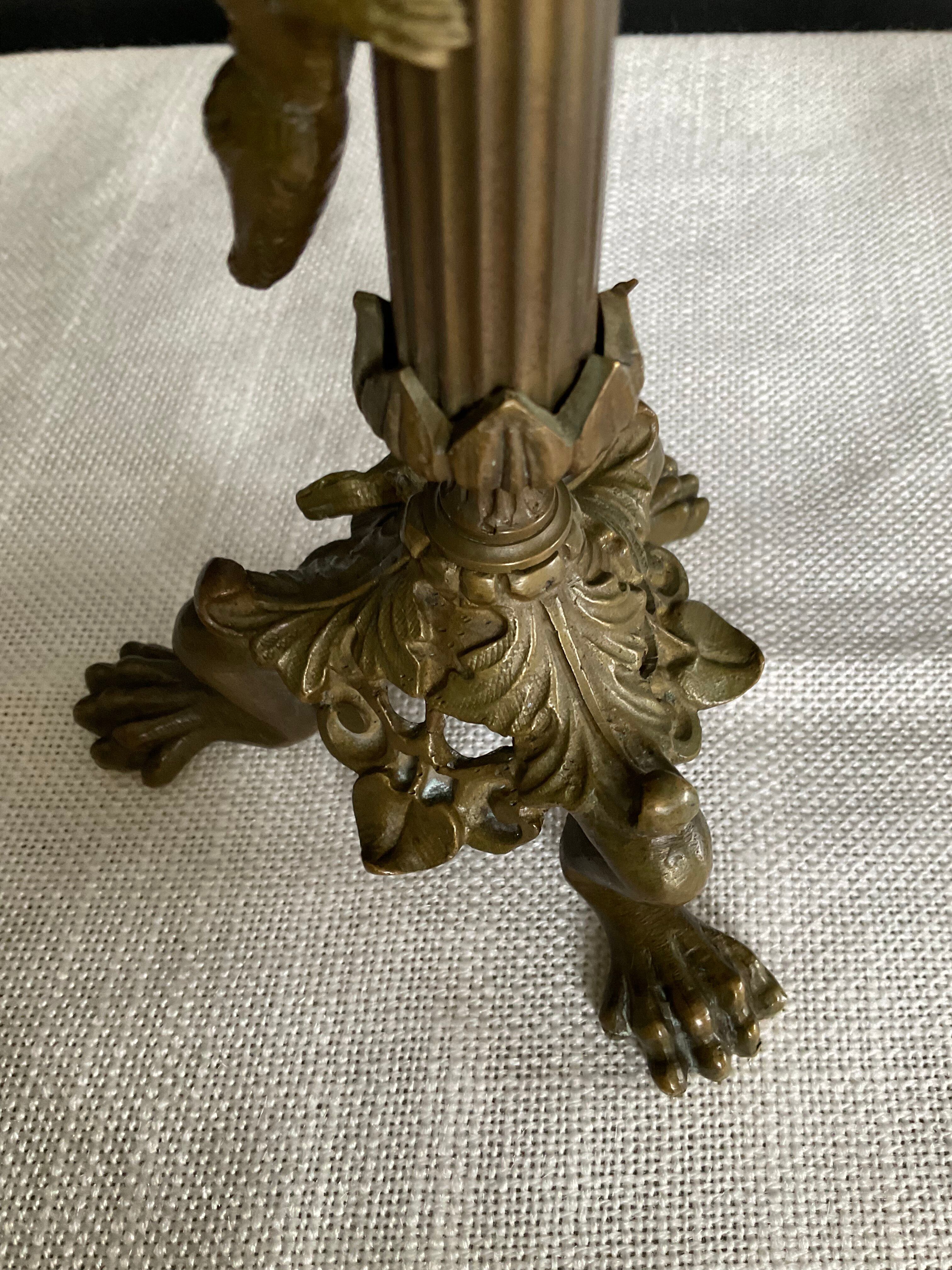 Pair of 19th-century gilded bronze candlesticks in Empire style.