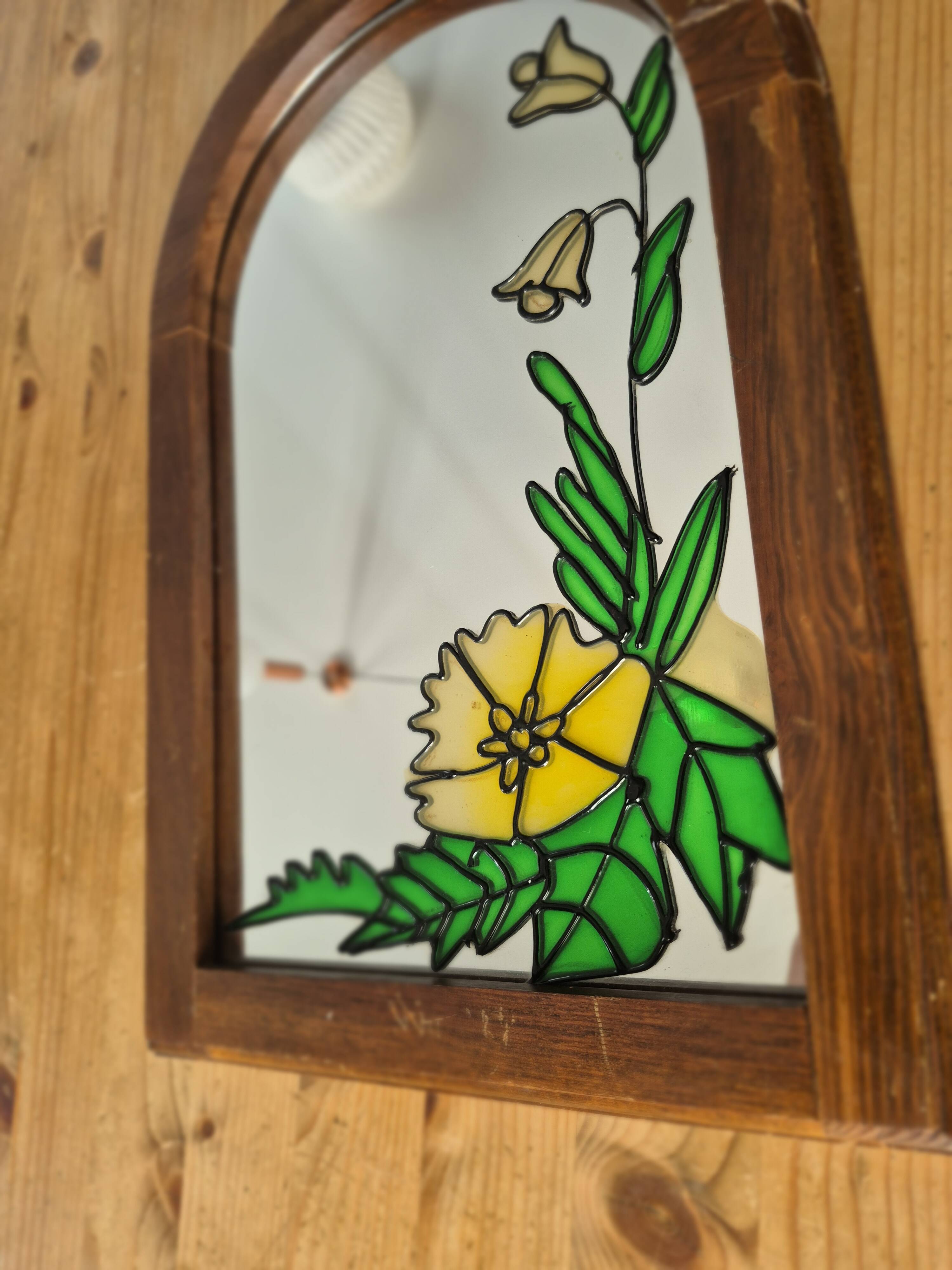 A pair of vintage stained glass style mirrors.