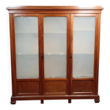 Large pine bookcase with three doors, fitted with frosted glass.