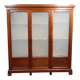 Large pine bookcase with three doors, fitted with frosted glass.