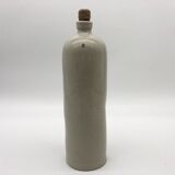 Old hot water bottle in glazed stoneware, gray color.
