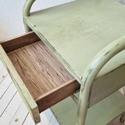 Copy of a pair of patinated metal bedside tables.