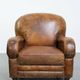 Charming and comfortable vintage armchair in grained cowhide leather with character