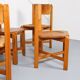 Set of 4 dining chairs in elm wood and cognac leather.