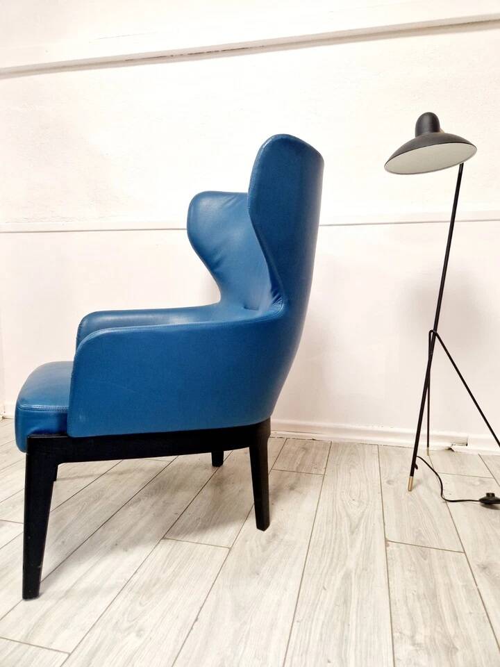 High-back armchair by Rodolfo Dordoni