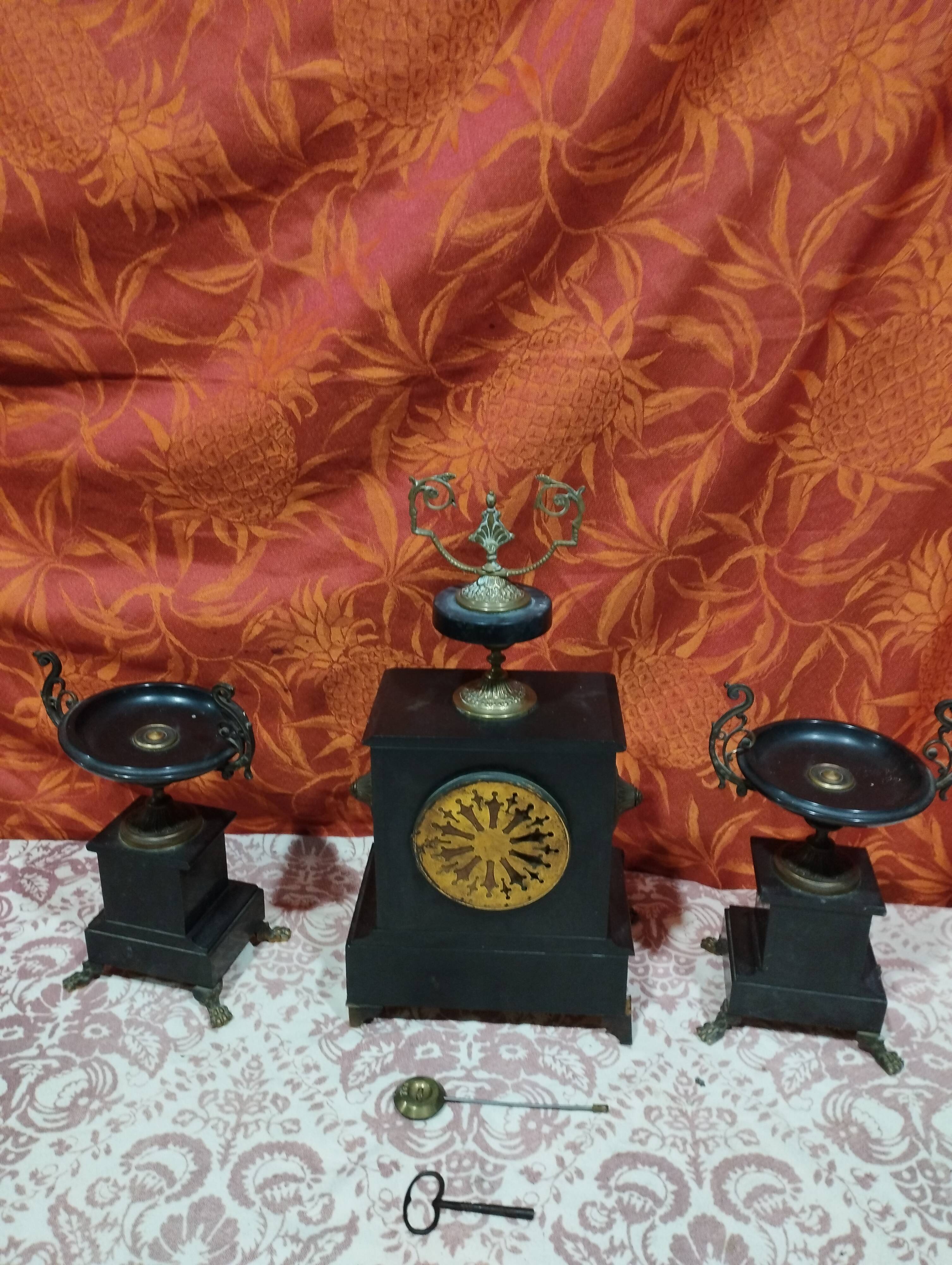 old Napoleon III marble fireplace surround with cups and pendulum