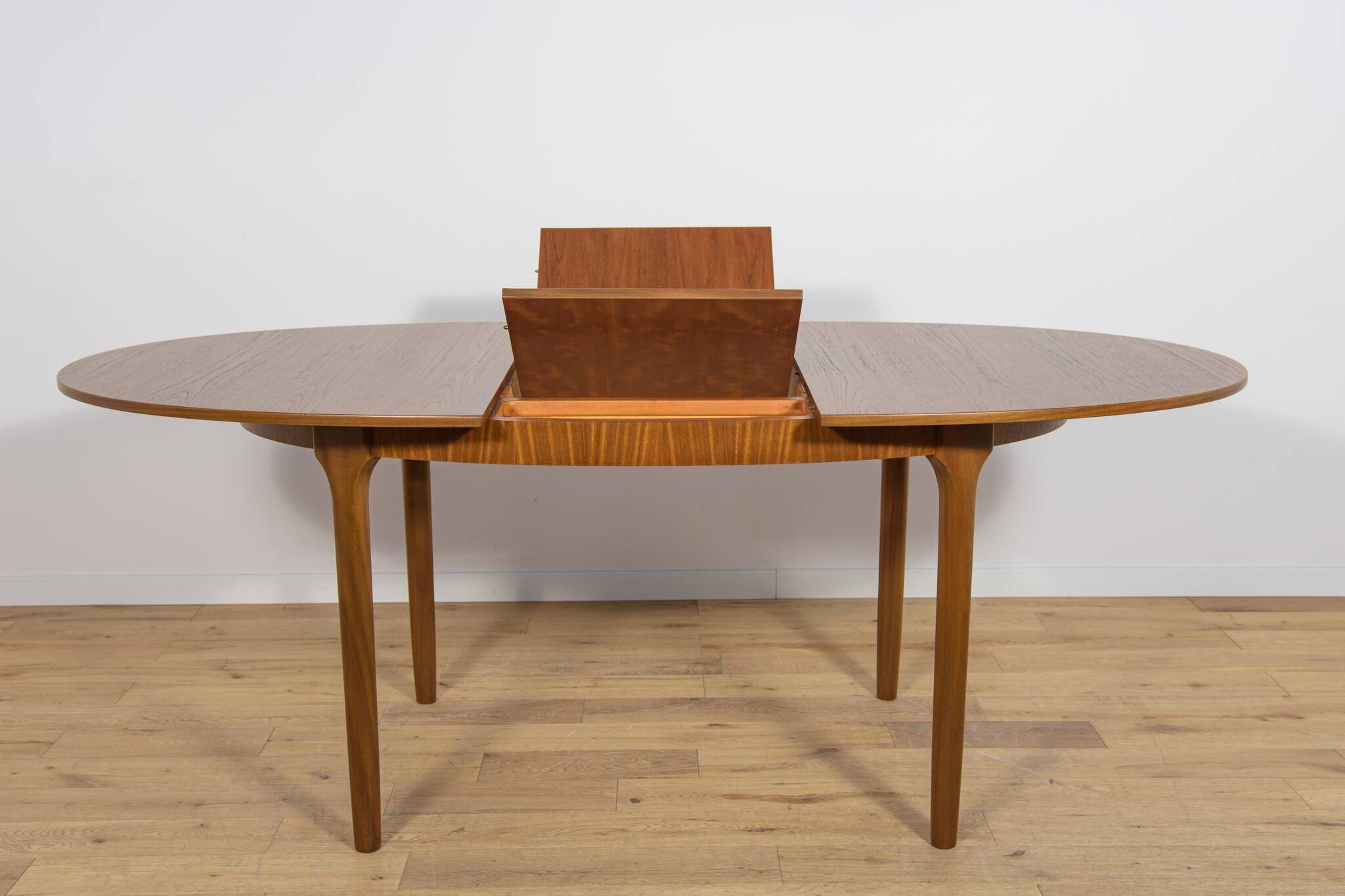 Mid-century extendable oval teak dining table from McIntosh, UK