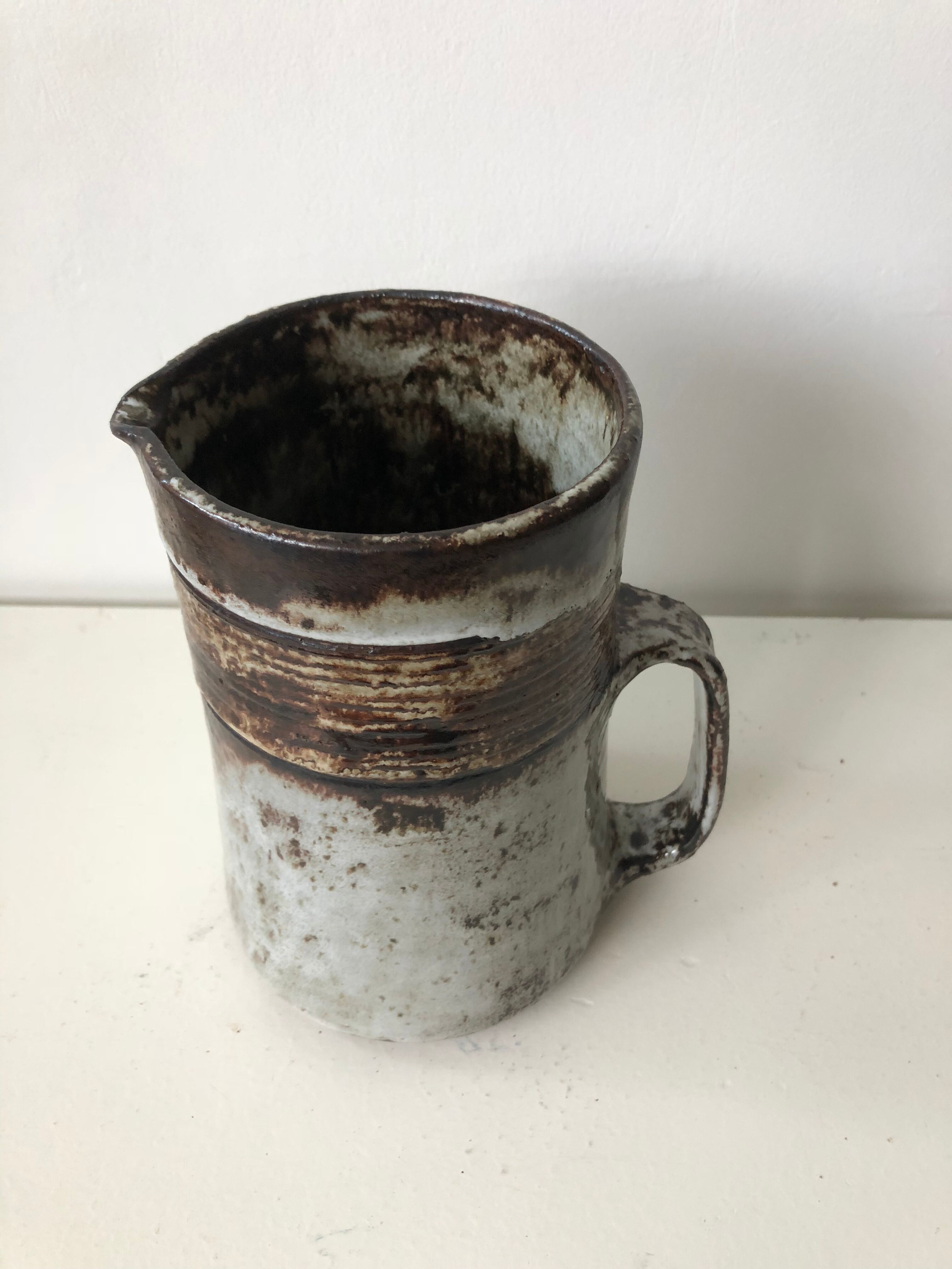 Brown grey enamelled stoneware pitcher