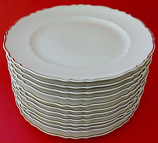 Suite of twelve table plates in white porcelain, golden lip