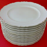 Suite of twelve table plates in white porcelain, golden lip