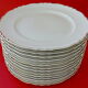 Suite of twelve table plates in white porcelain, golden lip
