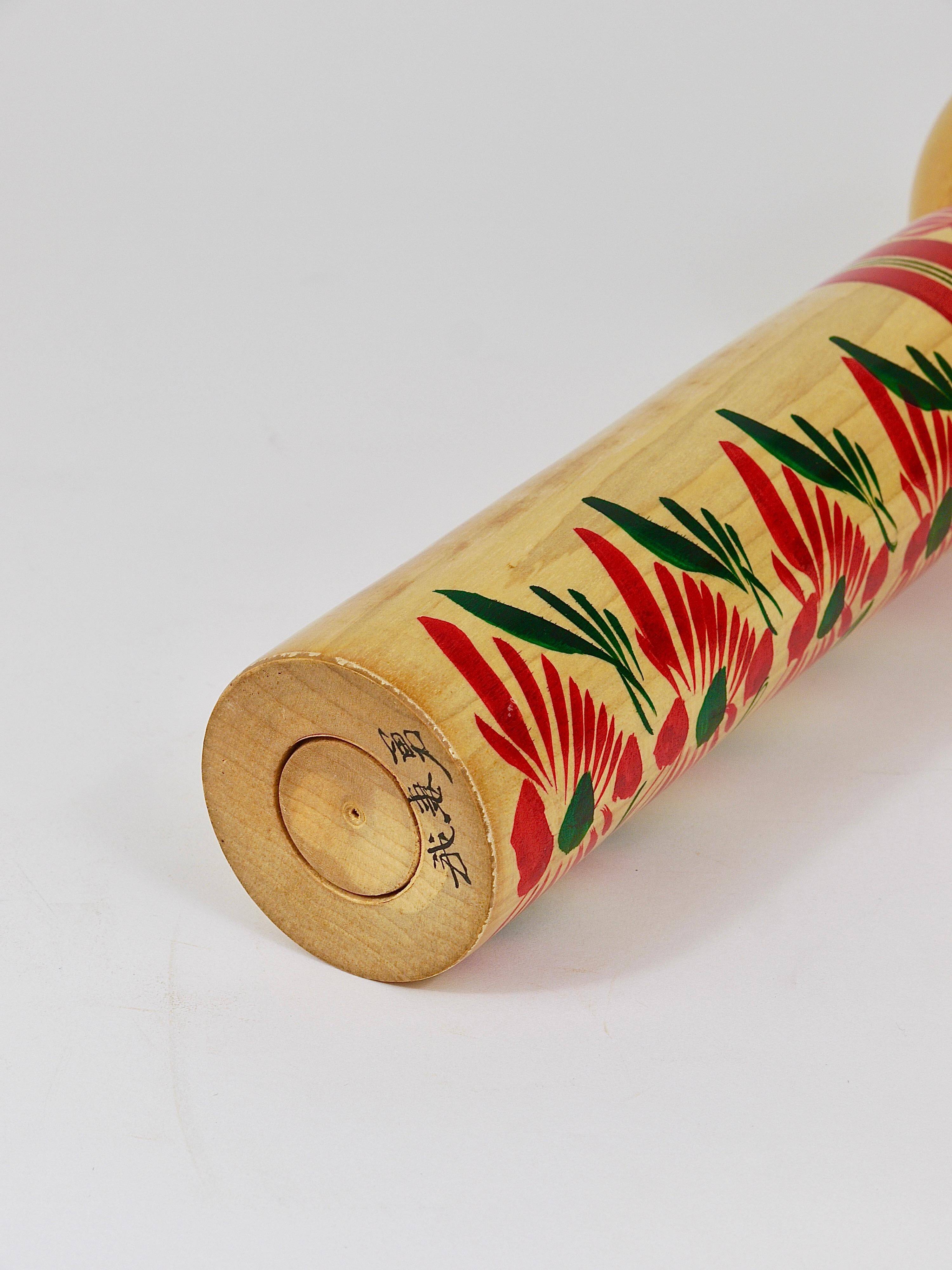 Decorative Kokeshi doll sculpture from northern Japan, hand-painted, signed.