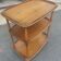 Rolling bar serving table in solid elm by Ercol, England, circa 1960
