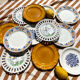 Set of twelve mismatched vintage dessert plates.