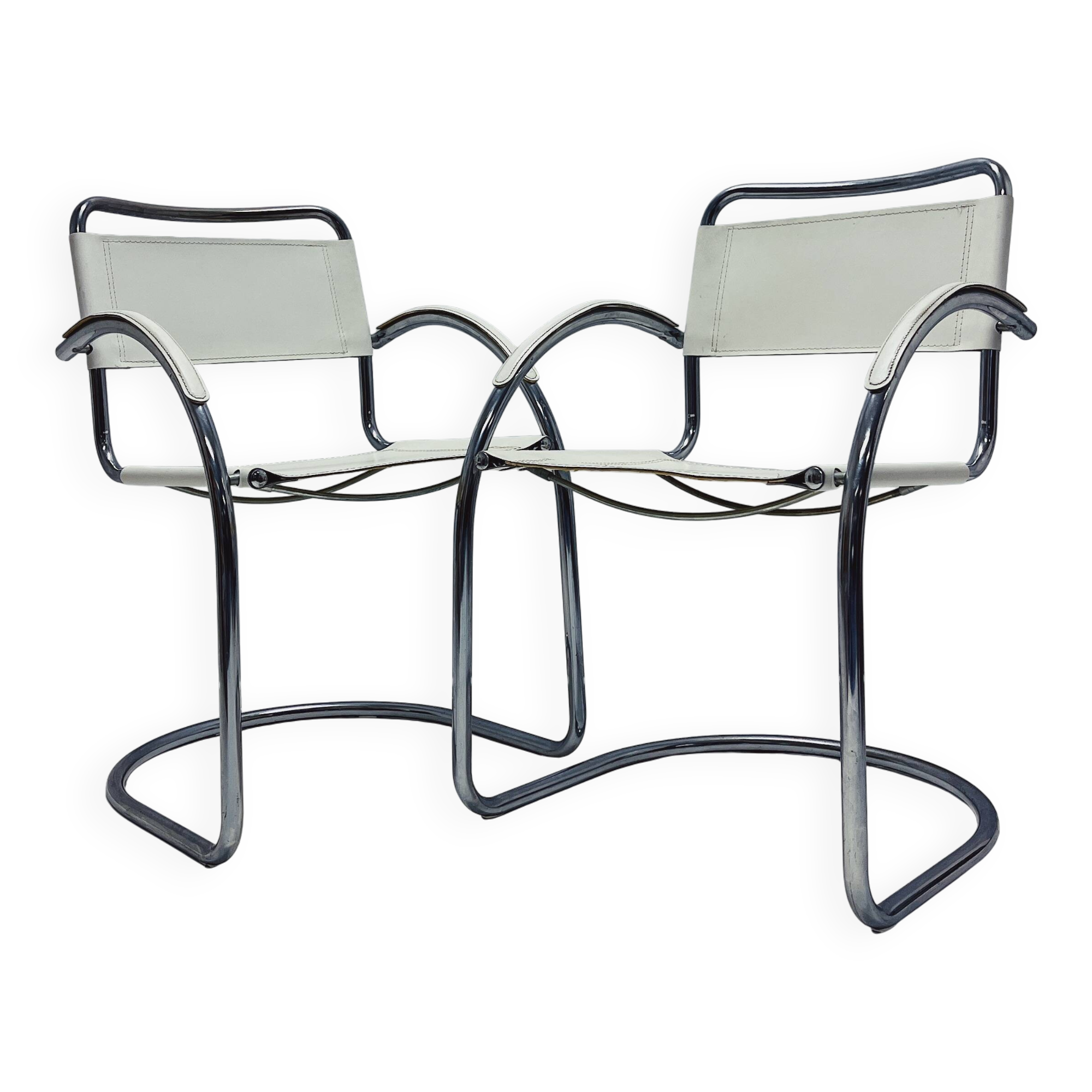 Vintage tubular frame chairs with white skai