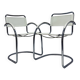 Vintage tubular frame chairs with white skai
