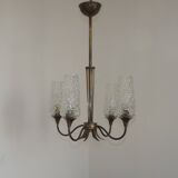 French vintage retro chandelier with 4 lights in brass and bronze with cut glass shades.