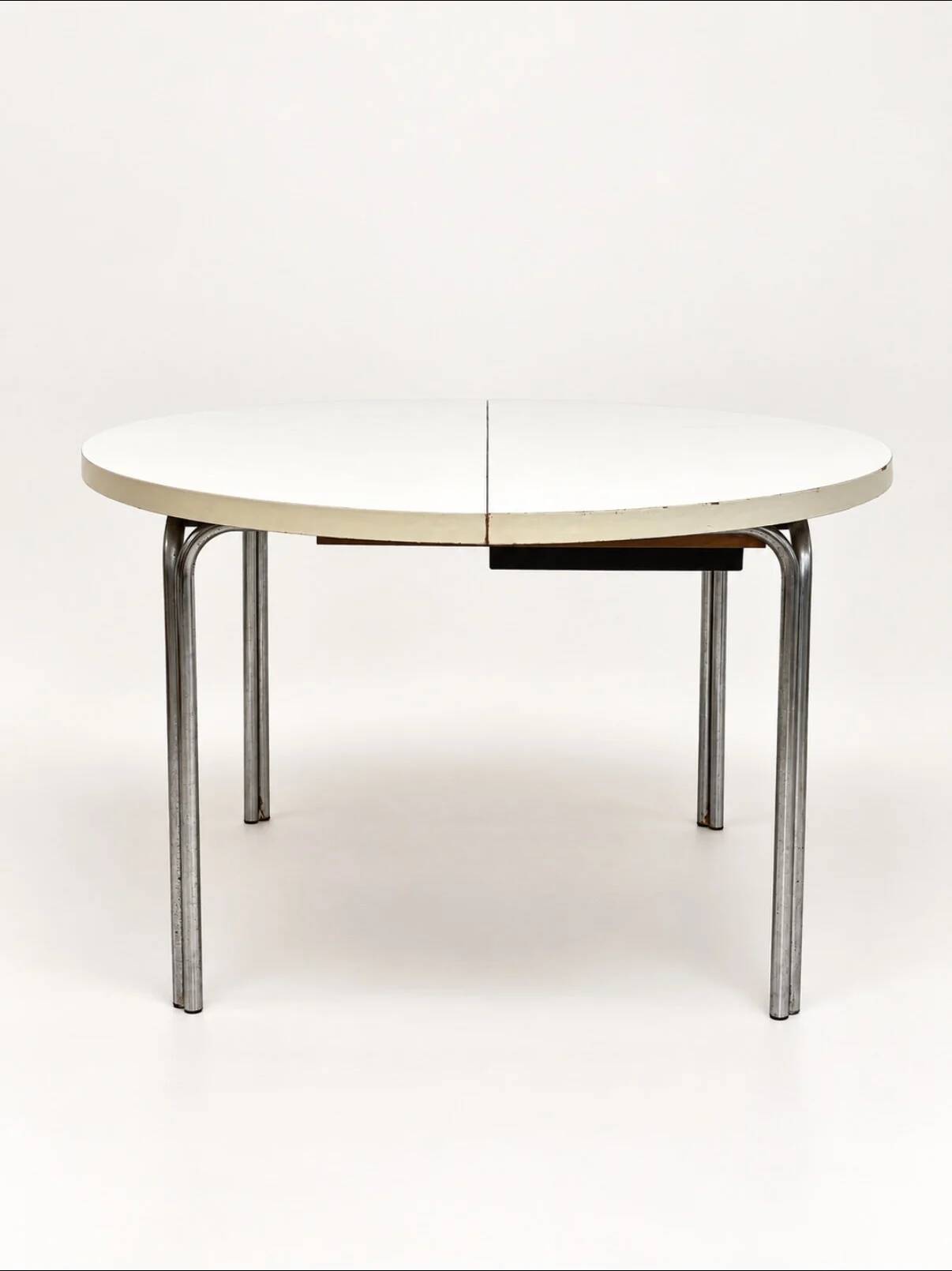 Vintage round extendable dining table, white laminate on chrome legs.