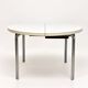 Vintage round extendable dining table, white laminate on chrome legs.