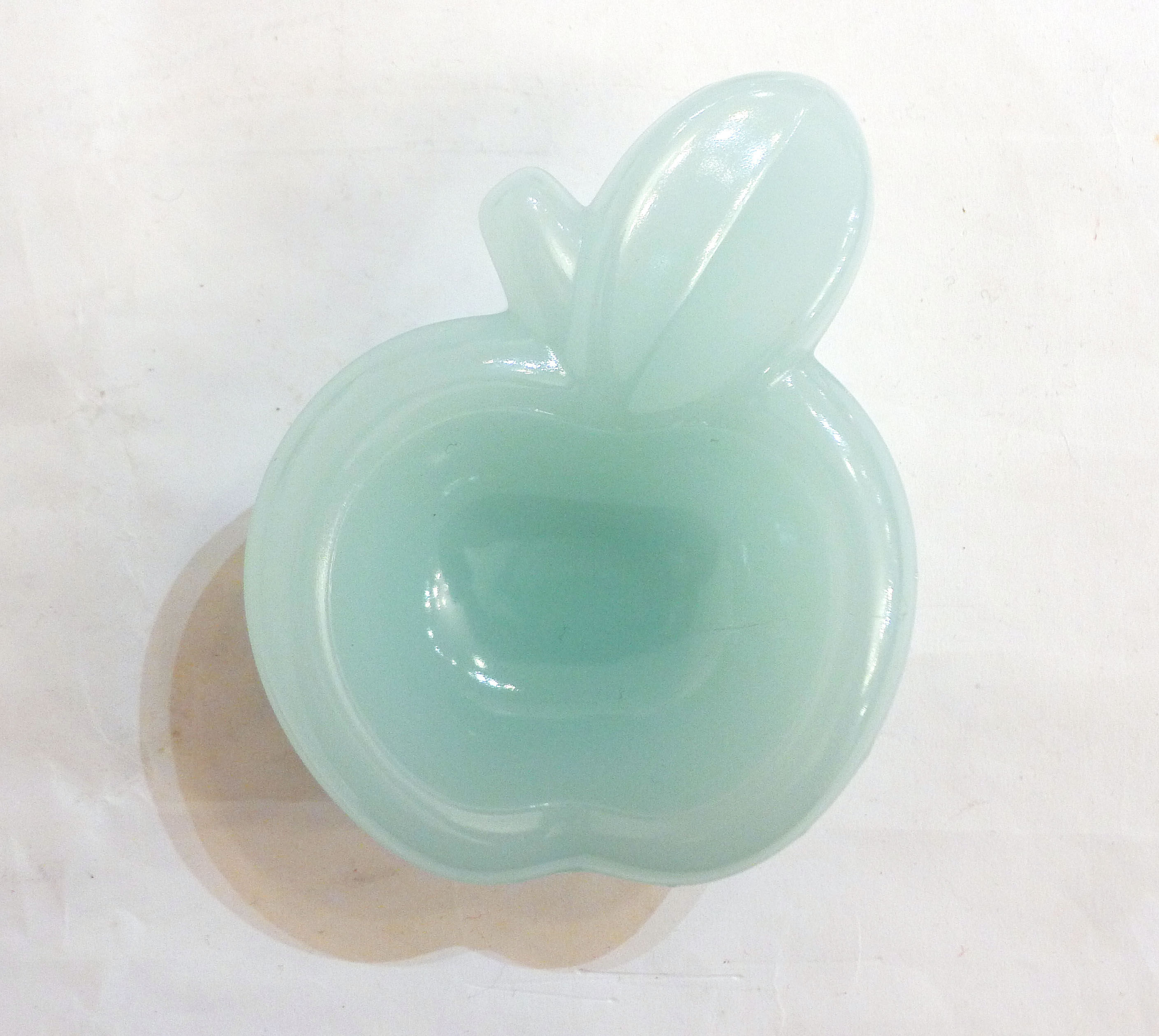 Pair of Apple opalin ashtrays