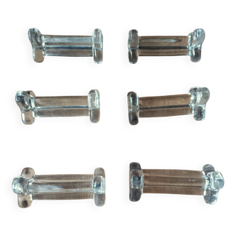 A set of 6 antique trilobed transparent glass knife holders