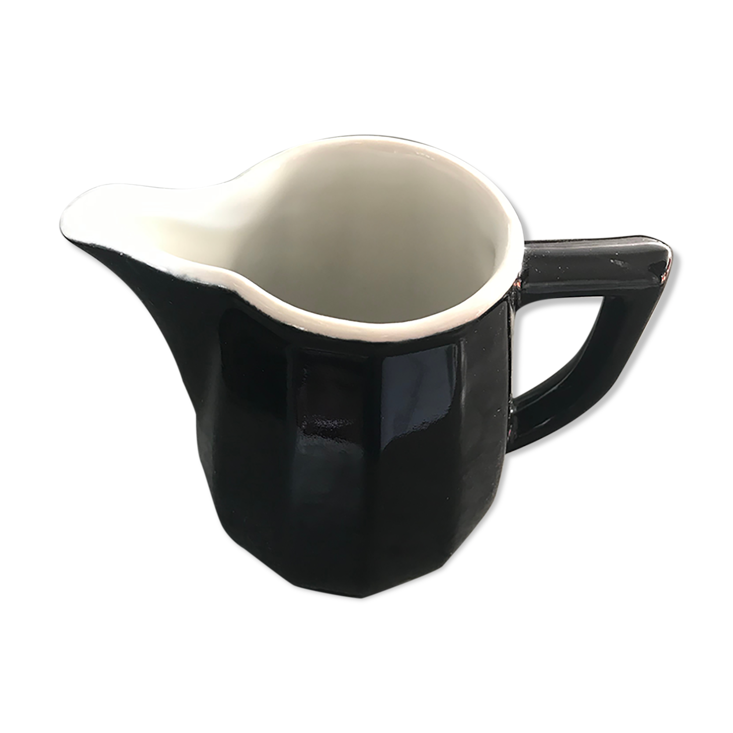 Milk pot in black and white earthenware