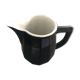 Milk pot in black and white earthenware