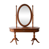 Traditional wooden dressing table with oval mirror.