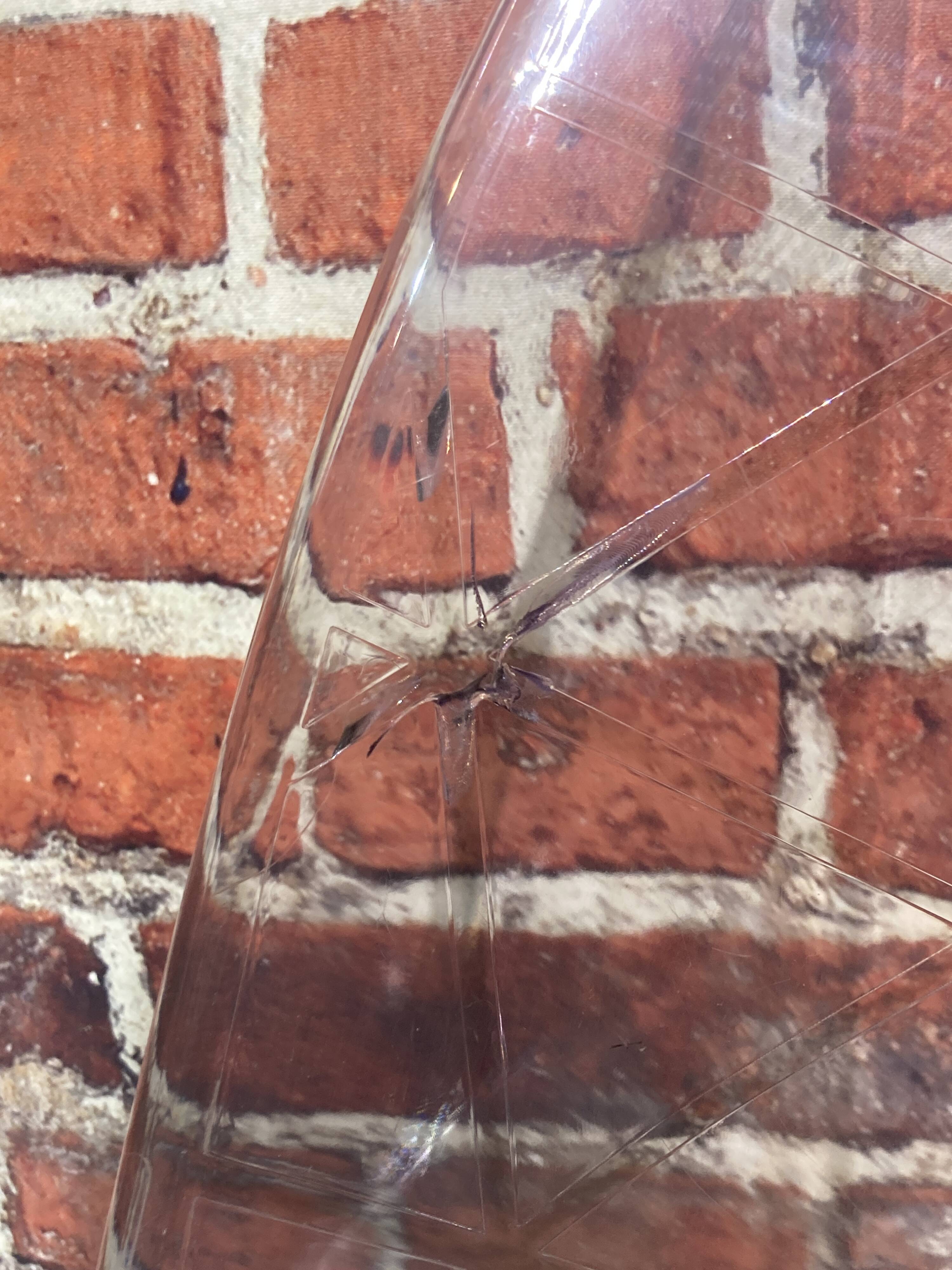 Set of four plexiglass and metal chairs
