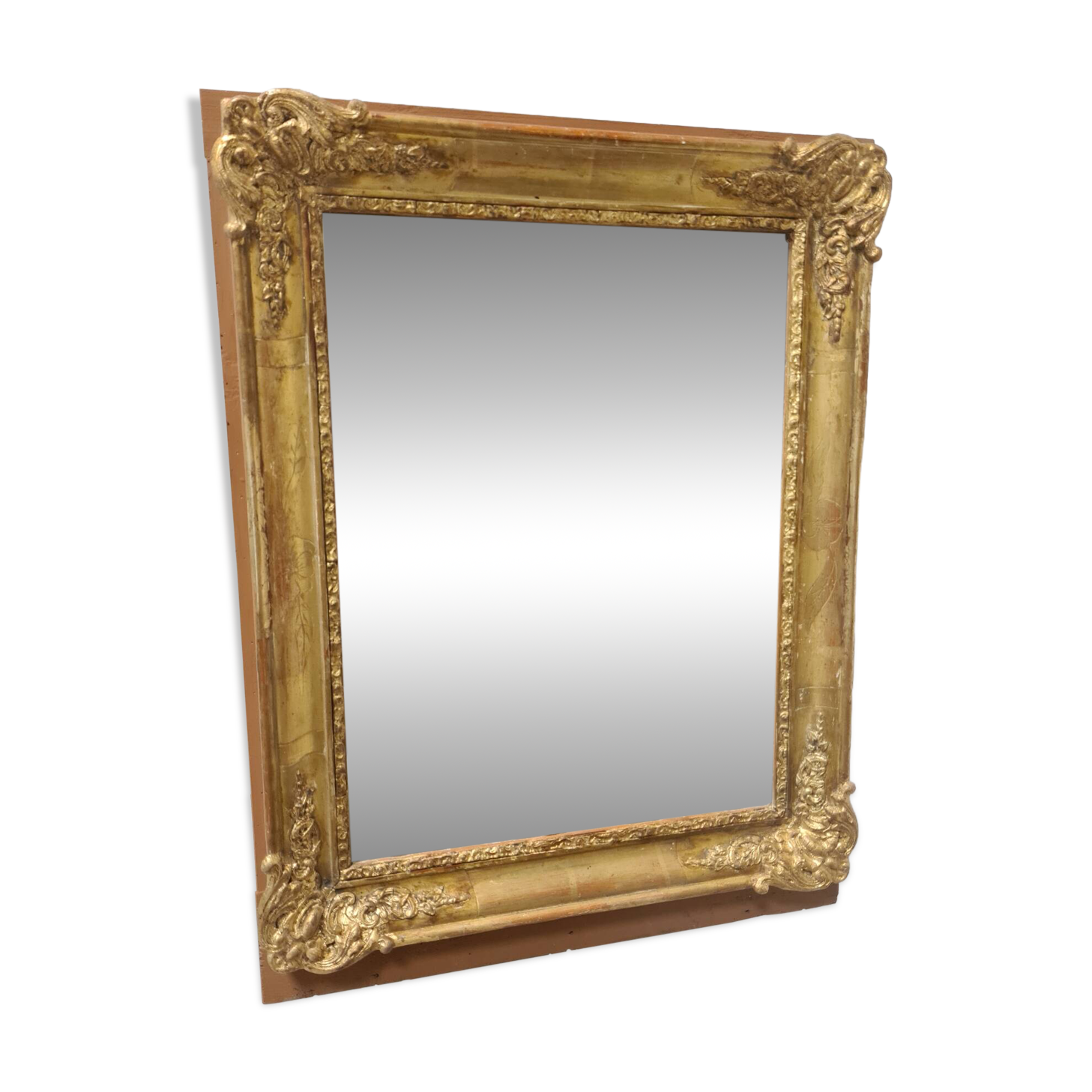 Antique gilded mirror, 19th century Empire style.