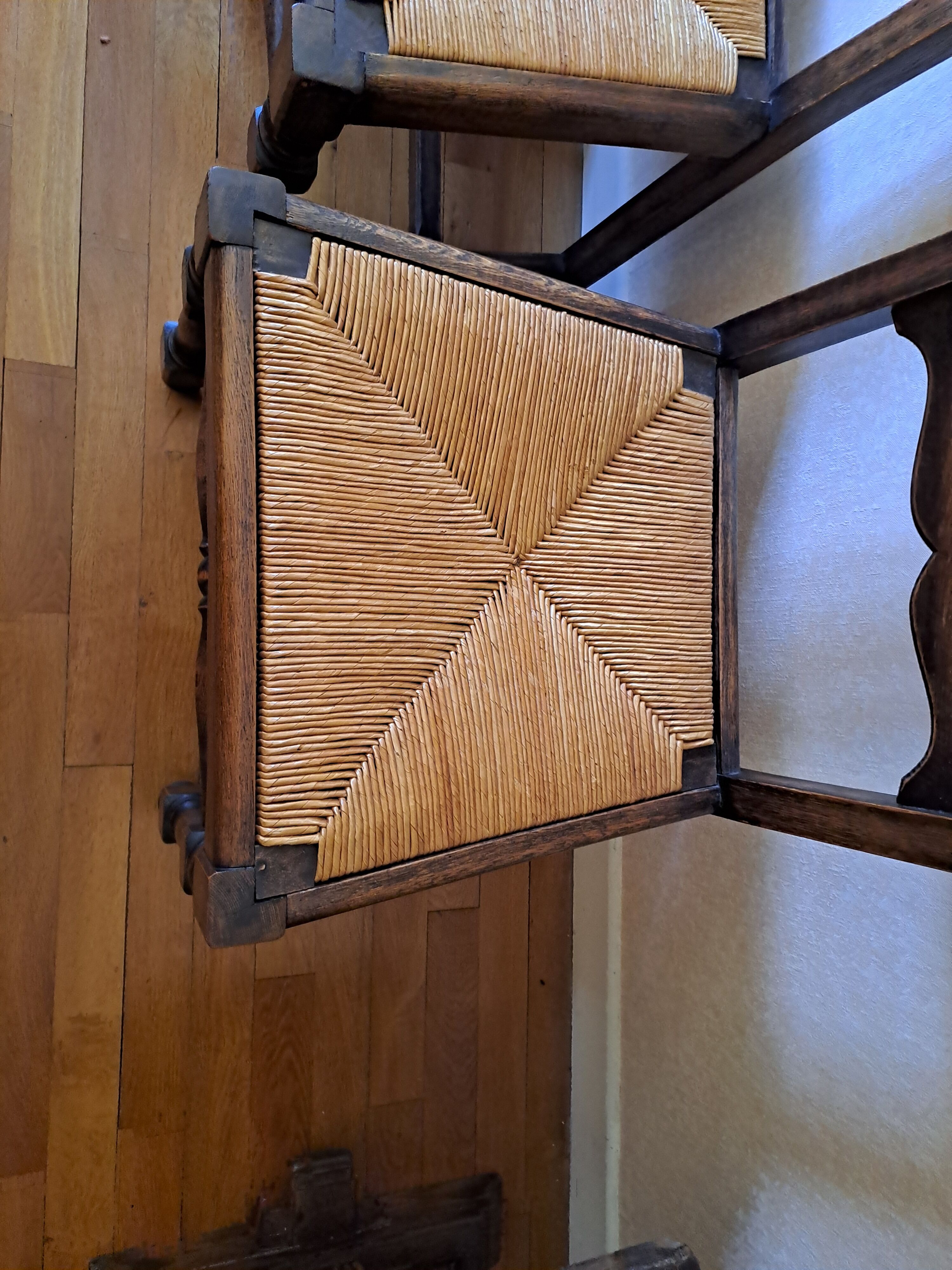 6 wooden and straw chairs