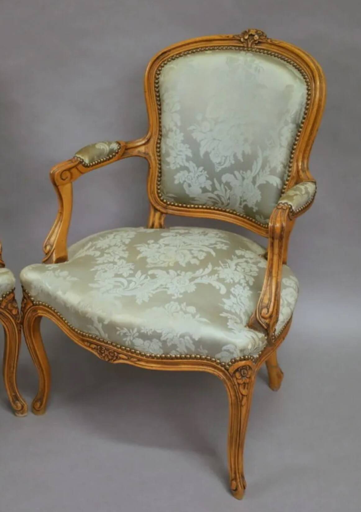 Pair of Louis XV style armchairs in moulded and carved beech.