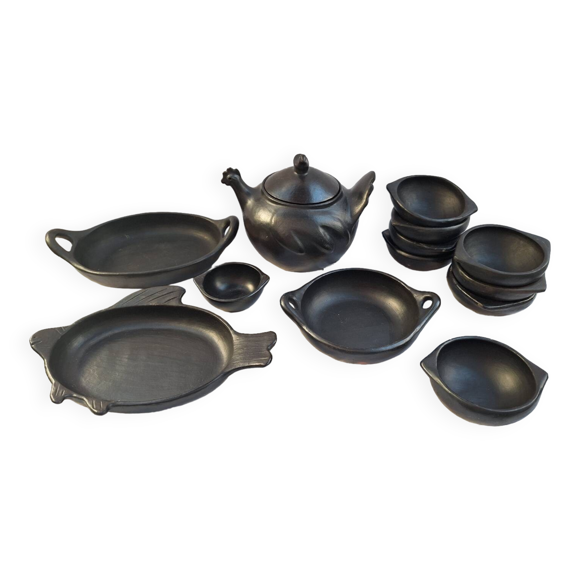 Black terracotta dinnerware set from La Chamba in Colombia. Set of 13 pieces.