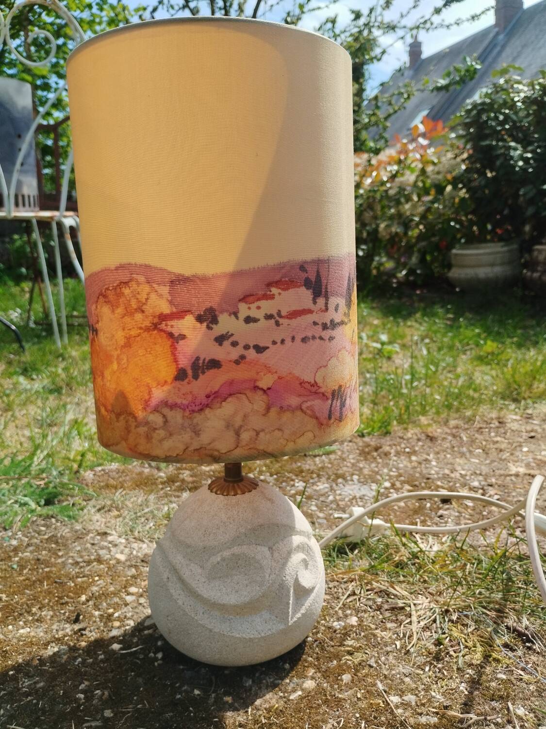 Vintage antique lamp with a stone base.