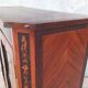 Louis XVI glass-fronted library in rosewood and amaranth veneer.