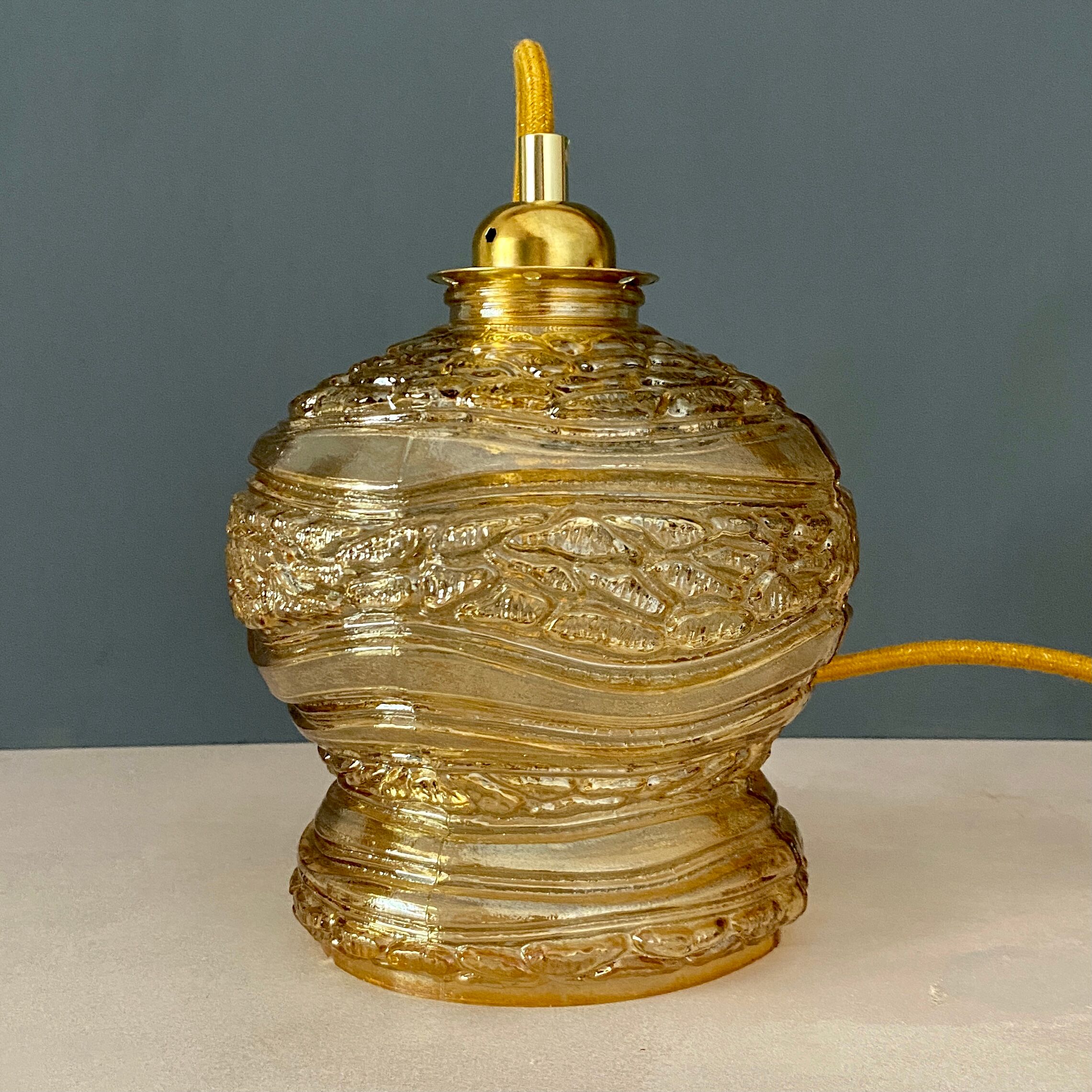 Vintage amber glass globe player