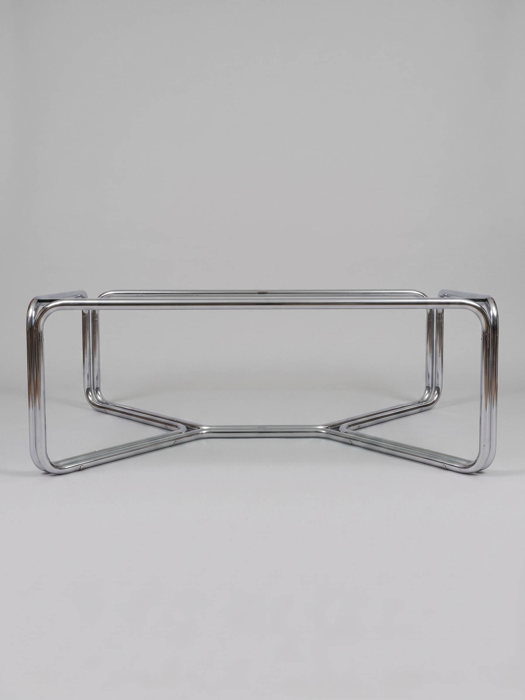 Chrome coffee table with a glass top.