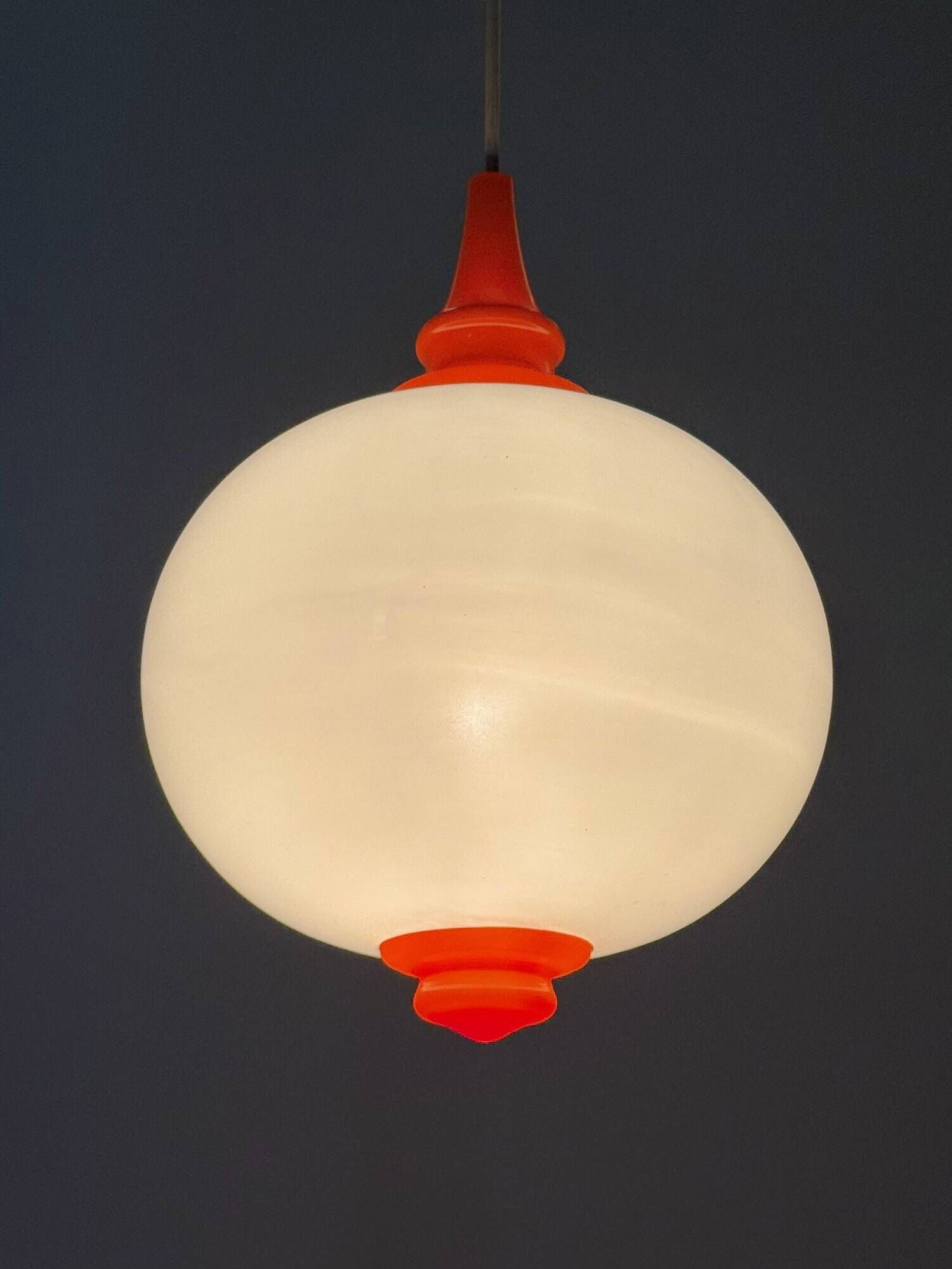 Space Age pendant lamp with milk glass ball and orange accents