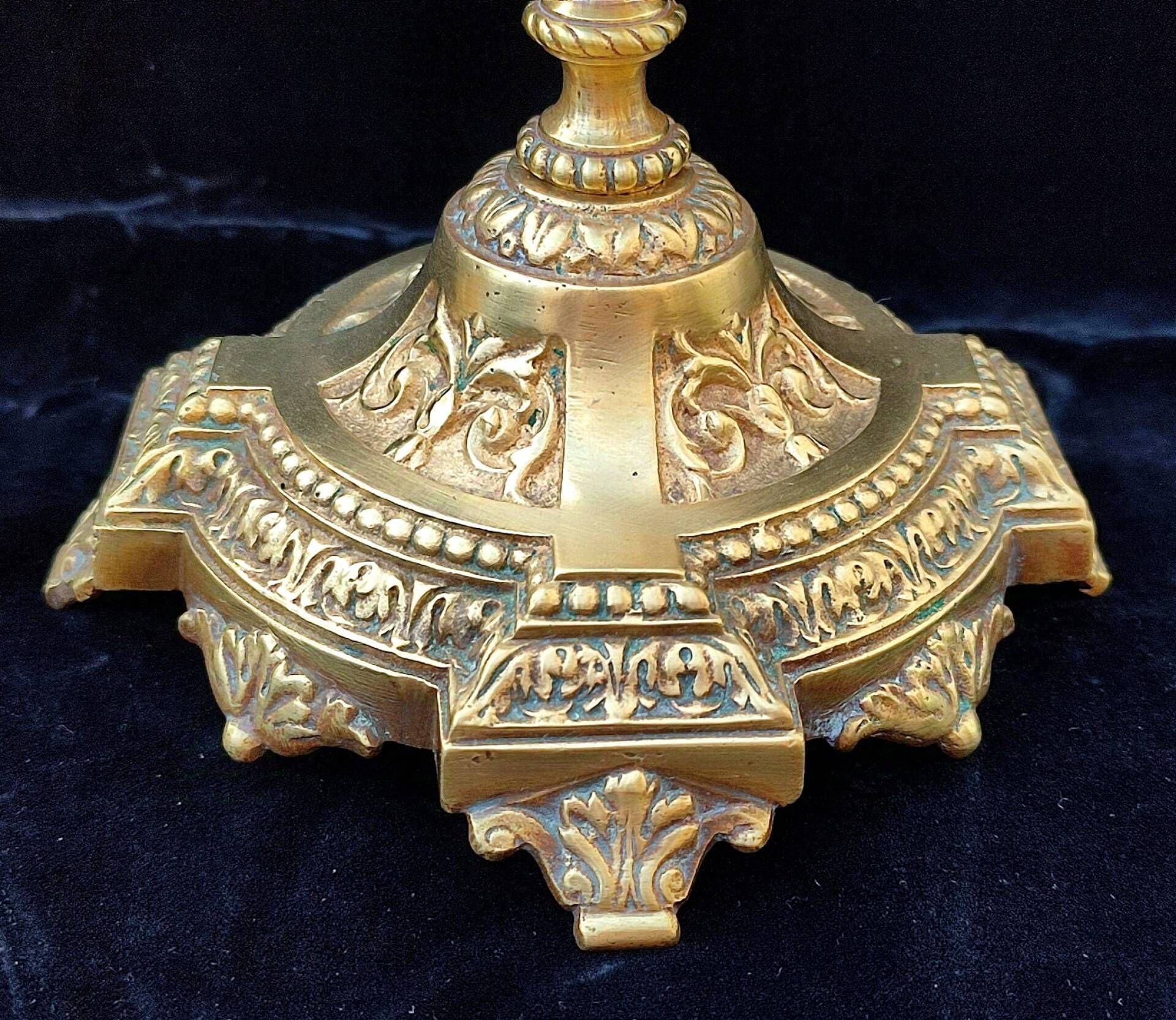 Pair of antique carved bronze candlesticks.