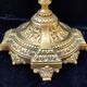 Pair of antique carved bronze candlesticks.