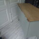 Green green vintage chest of drawers of gray, wood top.