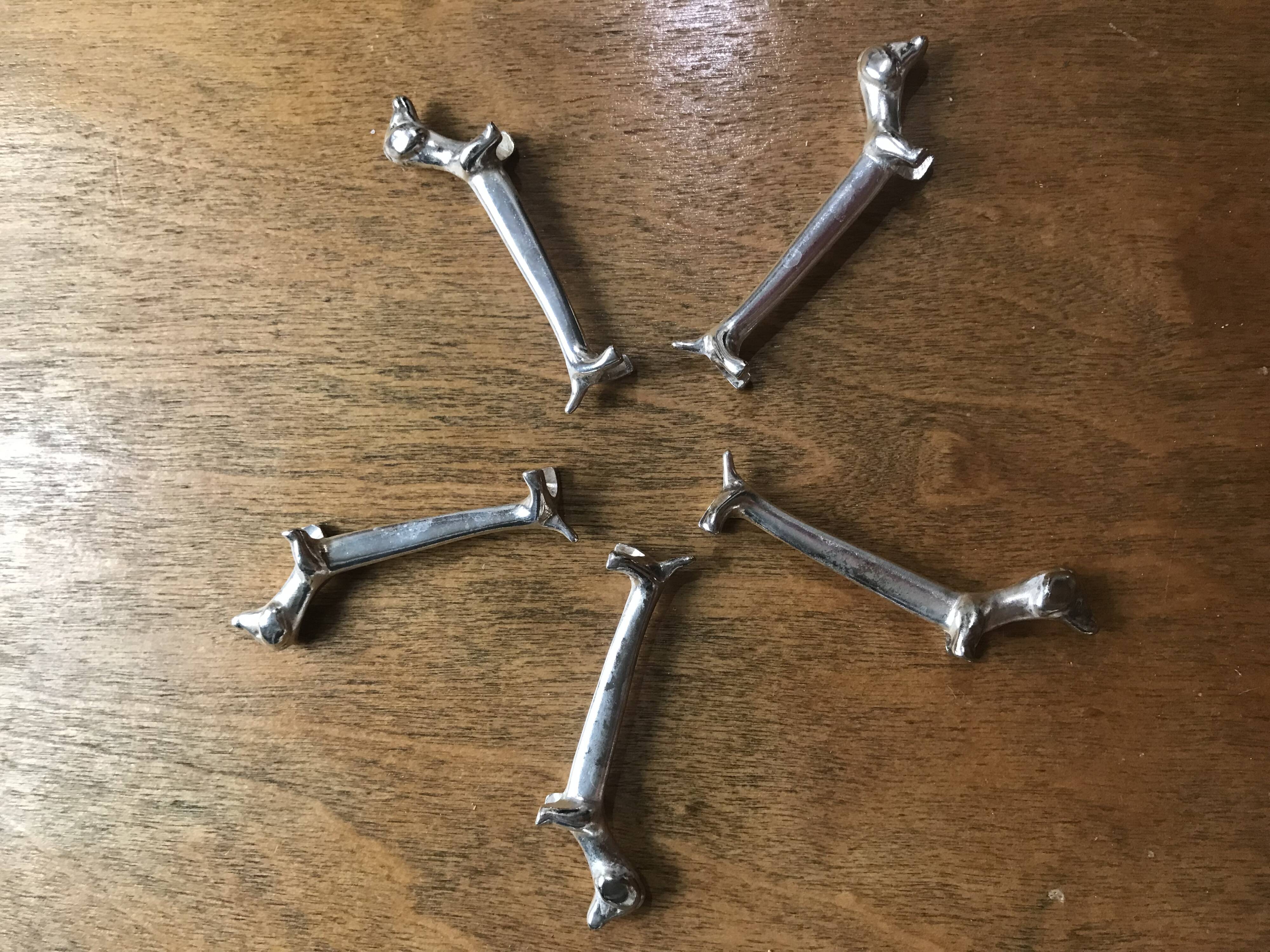 Set of five vintage basset hound knife holders